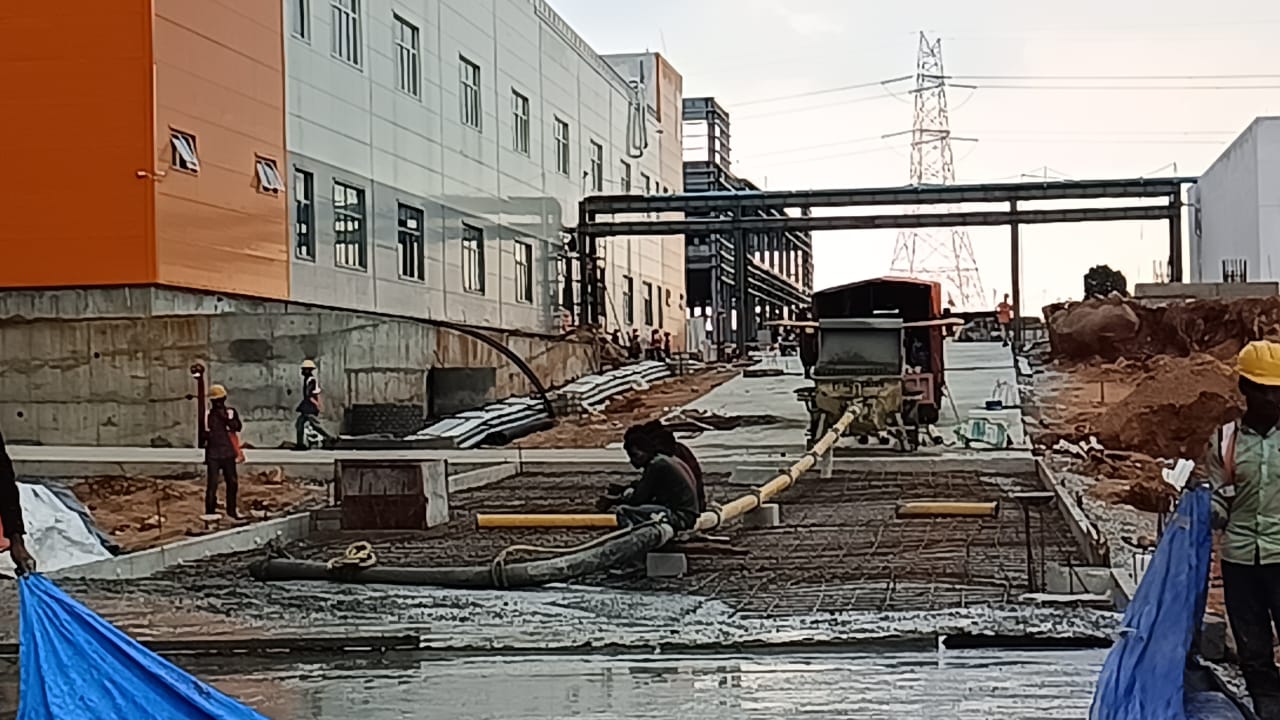 Concrete pouring with rebar and workers
